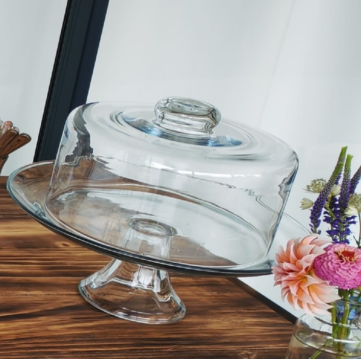 Glass cake stand with a dome